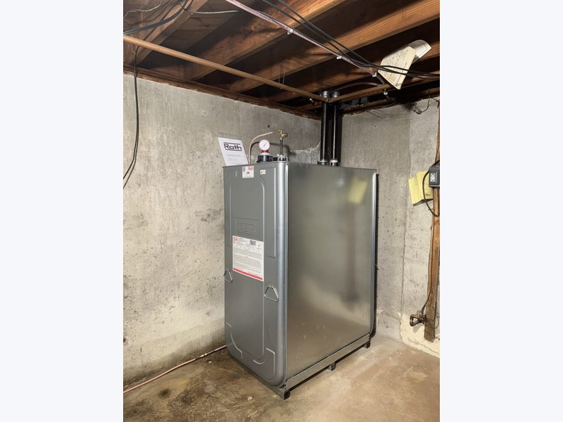Roth 275-gallon double-wall oil tank installed in a Long Island basement with copper piping