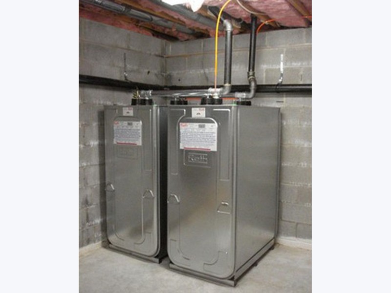 Dual Roth double-wall oil tanks installed side by side in a Long Island basement